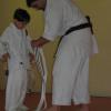 Eric LaLone tying the first ever Kickin' Kubs Black Belt on Christopher LaLone.